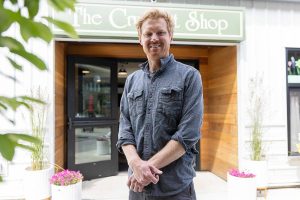 The Crumpet Shop owner Cooper Golding outside of their new location on Tuesday, June 24, 2025 in Edmonds, Washington. (Olivia Vanni / The Herald)