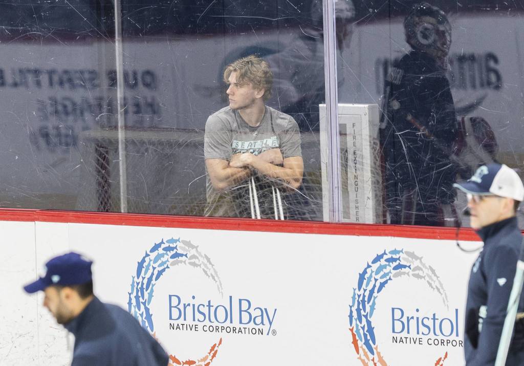 Kaden Hammell leans on his crutches as he watches the Kraken Development Camp on-ice session for forwards on Tuesday, July 1, 2025 in Seattle, Washington. (Olivia Vanni / The Herald)