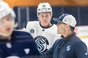 Julius Miettinen listens to a coach during Kraken Development Camp on-ice session for forwards on Tuesday, July 1, 2025 in Seattle, Washington. (Olivia Vanni / The Herald)