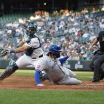 The Kansas City Royals Vinnie Pasquantino (9) safely slides home to score on Salvador Perezs double during the fifth inning against the Seattle Mariners at T-Mobile Park on Tuesday, July 1, 2025, in Seattle. (Alika Jenner / Getty Images / Tribune News Services)