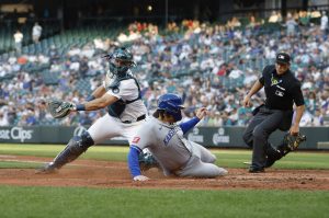 The Kansas City Royals' Vinnie Pasquantino (9) safely slides home to score on Salvador Perez's double during the fifth inning against the Seattle Mariners at T-Mobile Park on Tuesday, July 1, 2025, in Seattle. (Alika Jenner / Getty Images / Tribune News Services)