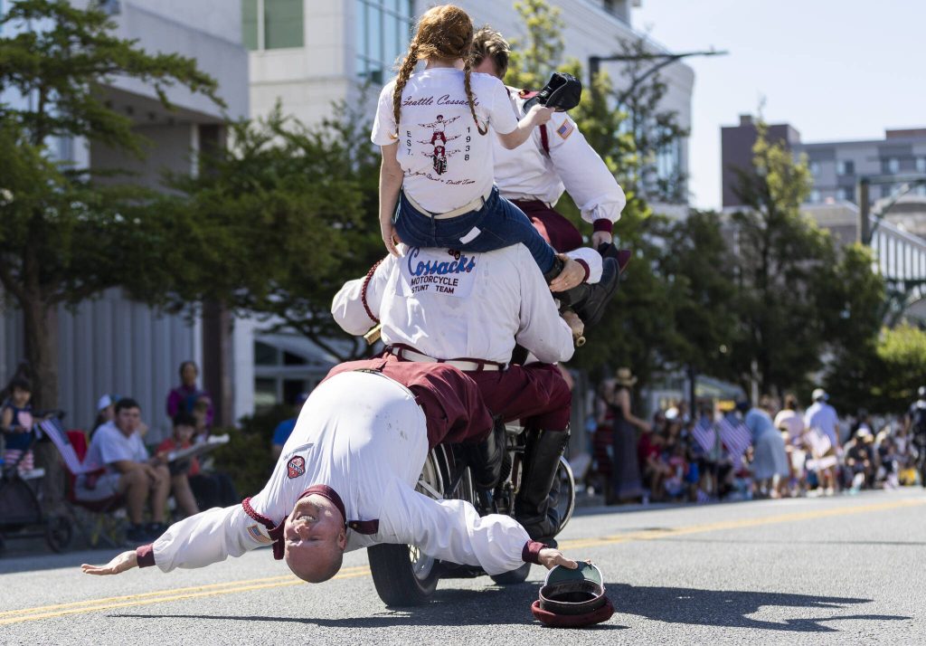 Cossacks Motorcycle Stunt Team perform during the Fourth of July parade on Friday, July 4, 2025 in Everett, Washington. (Olivia Vanni / The Herald)