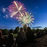 Thousands gather to watch fireworks over Lake Ballinger from Nile Shrine Golf Course and Lake Ballinger Park on Thursday, July 3, 2025 in Mountlake Terrace, Washington. (Olivia Vanni / The Herald)