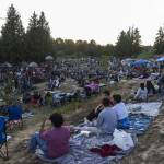Thousands sits at Lake Ballinger Park before the start of fireworks on Thursday in Mountlake Terrace. (Olivia Vanni / The Herald)