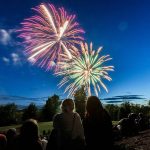 Thousands gather to watch fireworks over Lake Ballinger from Nile Shrine Golf Course and Lake Ballinger Park on Thursday, July 3, 2025 in Mountlake Terrace, Washington. (Olivia Vanni / The Herald)
