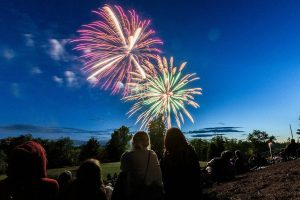 Thousands gather to watch fireworks over Lake Ballinger from Nile Shrine Golf Course and Lake Ballinger Park on Thursday, July 3, 2025 in Mountlake Terrace, Washington. (Olivia Vanni / The Herald)