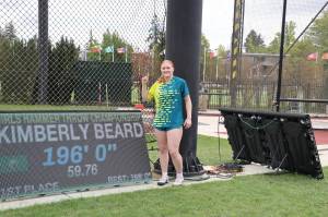 Kimberly Beard, a rising senior at King's, stands next to the results board after winning the girls hammer throw at the Nike Outdoor National Track & Field Championships in Eugene, Oregon on June 22, 2025. (Photo courtesy Donna Beard)