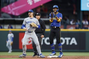 The Seattle Mariners' Julio Rodríguez, right, claps after stealing second base during the first inning against the Kansas City Royals at T-Mobile Park on Thursday, July 3, 2025, in Seattle. (Alika Jenner / Getty Images / Tribune News Services)