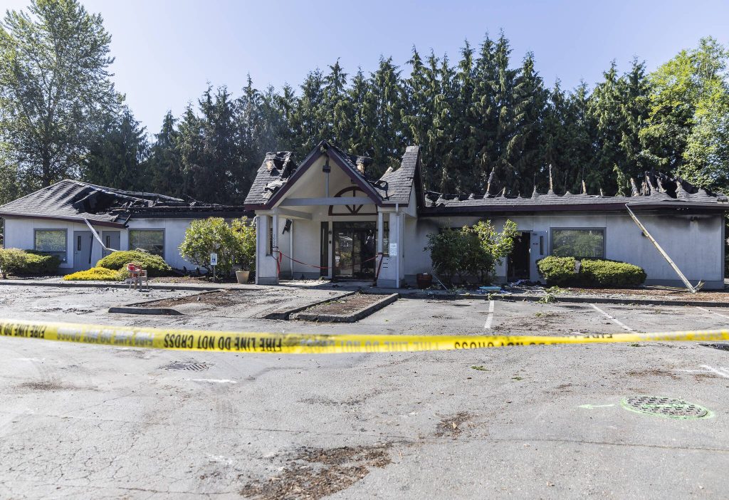 Smoke rises from a burned Center for Human Services building along 204th Street on Monday, July 7, 2025 in Lynnwood, Washington. (Olivia Vanni / The Herald)