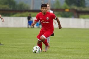 Midfielder Christian Soto dribbles up field during Snohomish United's 5-1 win against the Tacoma Stars at Stockers Fields on July 9, 2025 (Joe Pohoryles / The Herald)