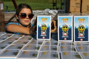 Lily Lamoureux stacks Weebly Funko toys in preparation for Funko Friday at Funko Field in Everett on July 12, 2019.  Kevin Clark / The Herald)