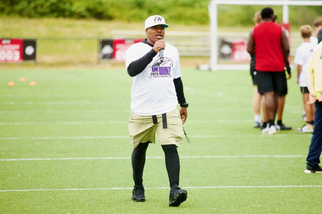 FlexWork Camp Director Ed Galloway addresses the campers during Rome Odunzes youth football camp at Archbishop Murphy High School on July 10, 2025. (Joe Pohoryles / The Herald)