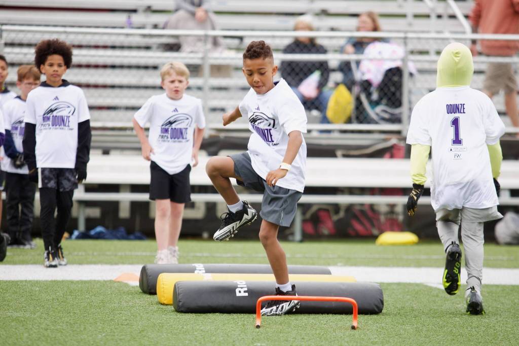 A camper at Rome Odunzes youth football camp goes through an agility drill at Archbishop Murphy High School on July 10, 2025. (Joe Pohoryles / The Herald)