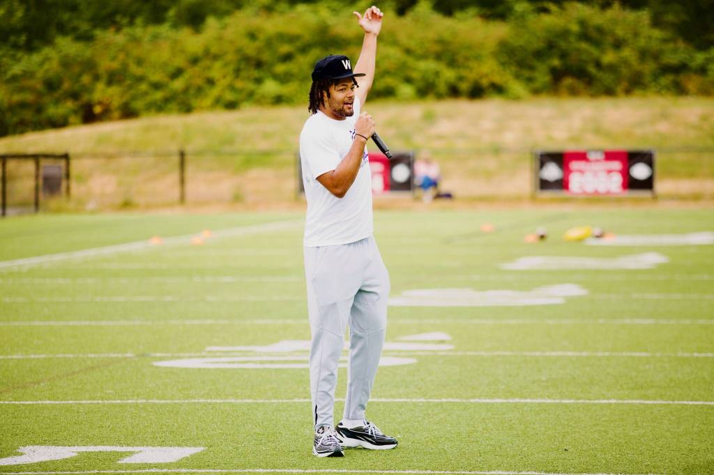 Rome Odunze addresses the campers at his youth football camp at Archbishop Murphy High School on July 10, 2025. (Joe Pohoryles / The Herald)