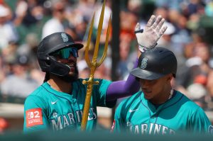 Jorge Polanco (7), right, of the Seattle Mariners celebrates his ninth inning home run with J.P. Crawford (3) while playing the Detroit Tigers at Comerica Park on Sunday, July 13, 2025, in Detroit. (Gregory Shamus / Getty Images / Tribune News Services)