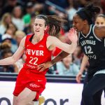 Indiana Fever guard Caitlin Clark (22) tries to fend off Aces guard Chelsea Gray (12) during a WNBA basketball game between the Aces and Indiana Fever at T-Mobile Arena on Sunday, June 22, 2025, in Las Vegas. (Madeline Carter / Las Vegas Review-Journal / Tribune News Services)