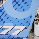Casey McDowell, a composite spar machine operator, waits during a countdown to drill the first hole in the 777-8 Freighter wing spar on Monday, July 21, 2025 in Everett, Washington. (Olivia Vanni / The Herald)