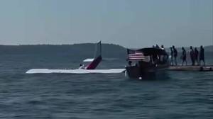 Screenshot from a video given by a bystander to police. The Cessna plane is floating in the water near Lighthouse Park in Mulkilteo as the three occupants try to escape. Rescuers wait to help nearby. (Photo provided by Mulkiteo Police Department)
