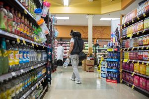 Ben Paul walks through QFC with Nala on Saturday, July 14, 2018 in Everett, Wa. (Olivia Vanni / The Herald)