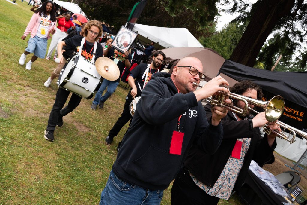 Musicians perform during a second line parade honoring Marylin Quincy at the 33rd annual Nubian Jam on Saturday, July 26 at Forest Park in Everett, Washington. (Will Geschke / The Herald)