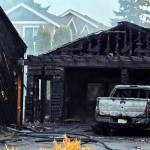 Flames and smoke destroyed an Edmonds homes garage and significantly damaged the main house and two vehicles early Friday morning near Lake Ballinger. (Provided photo)