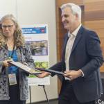 Public Works Director Kellie Snyder and Executive Director of the Puget Sound Regional Council Josh Brown hand out Vision 2050 awards for the Little Bear Creek Advance Mitigation Site on Monday, July 28, 2025 in Everett, Washington. (Olivia Vanni / The Herald)
