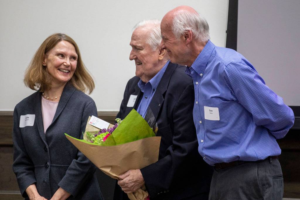 Annie Barker / The Herald
Julie Muhlstein, left, and Dan Bates, right, receive congratulations from Larry Hanson, center, as they are recognized by the Everett Museum of History for their contributions as longtime former Herald journalists in 2023.
Julie Muhlstein, left, and Dan Bates, right, receive congratulations from Larry Hanson, center, as they are recognized by the Everett Museum of History for their contributions as longtime former Herald journalists at the museums annual fundraiser at the Henry M Jackson Conference Center in Everett on Feb. 26, 2023. (Annie Barker / The Herald)