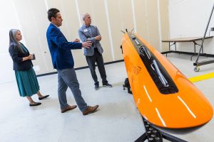 Kongsberg Director of Government Relations Jake Tobin talks to Rep. Rick Larsen about the HUGIN Edge on Thursday, July 31, 2025 in Lynnwood, Washington. (Olivia Vanni / The Herald)