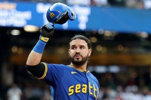 Eugenio Suarez acknowledges the crowd at T-Mobile Park in Seattle, Washington on July 31, 2025 in his first action after returning to the Mariners after a trade from Arizona. (Steph Chambers / Getty Images / Tribune News Services)