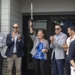 Sen. June Robinson raises scissors after the ribbon cutting for the new Marysville Family YMCA Early Learning Center on Tuesday, Aug. 5, 2025 in Marysville, Washington. (Olivia Vanni / The Herald)