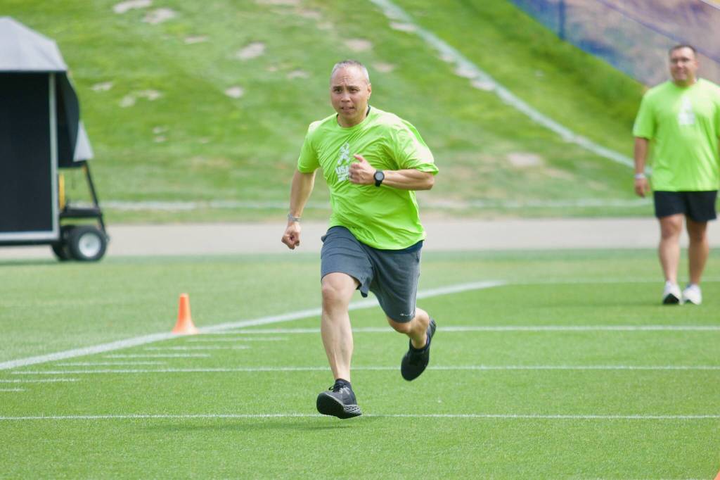 Mike Bordas, a First Class Yeoman in the Coast Guard, runs in the 40-yard dash during the USAAs Salute to Service NFL Boot Camp hosted by the Seattle Seahawks at Virginia Mason Athletic Center on Aug. 4, 2025. (Joe Pohoryles / The Herald)