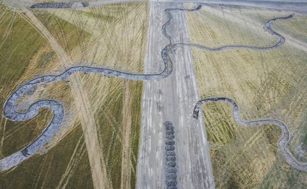 Excavator dug channels cover the surface of the Zis A Ba site on Wednesday, Aug. 6, 2025 in Stanwood, Washington. (Olivia Vanni / The Herald)