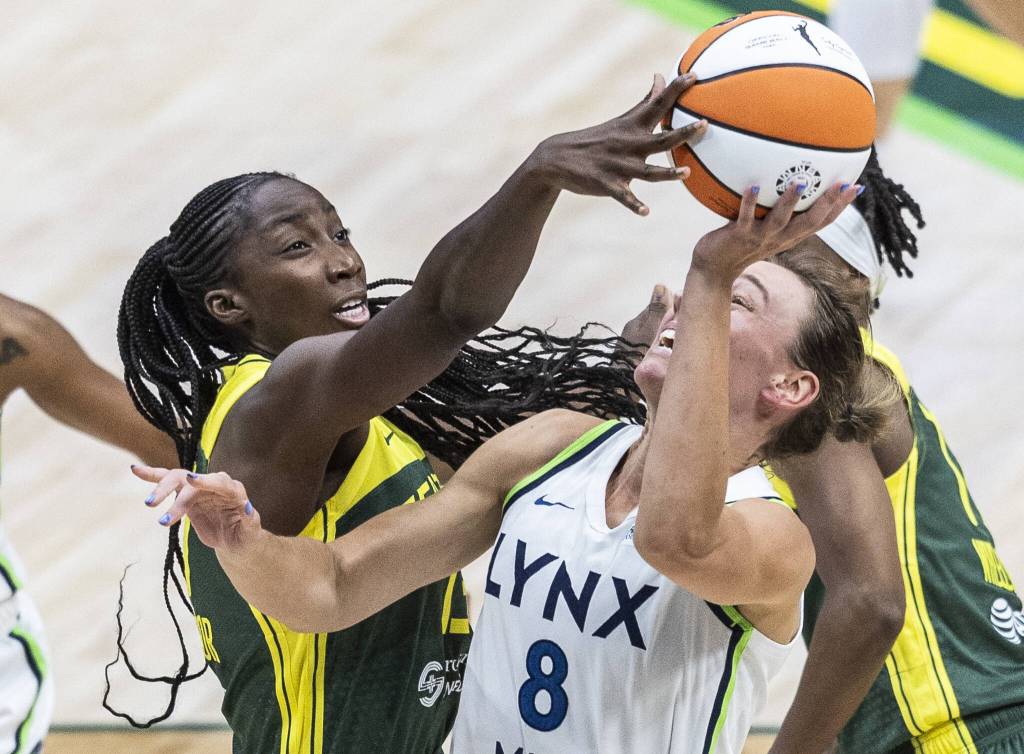 Seattle Storms Ezi Magbegor reaches up and blocks a shot by Minnesota Lynxs Alanna Smith during the game on Tuesday, Aug. 5, 2025 in Seattle, Washington. (Olivia Vanni / The Herald)