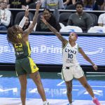 Seattle Storms Tiffany Mitchell takes a jump shot as Minnesota Lynxs Courtney Williams reaches to block it during the game on Tuesday, Aug. 5, 2025 in Seattle, Washington. (Olivia Vanni / The Herald)