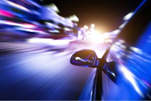 Night drive with motion blur city background