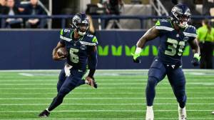 Seahawks quarterback Jalen Milroe runs with the ball in Seattle's preseason opener against the Las Vegas Raiders at Lumen Field in Seattle, Washington on Thursday, August 7, 2025. (Photo courtesy of the Seattle Seahawks)