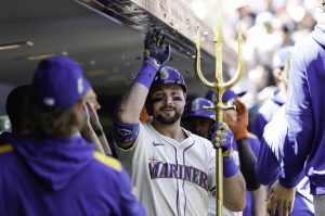 Cal Raleigh (29) of the Seattle Mariners celebrates with teammates in the dugout after hitting a two-run home run during the first inning against the Tampa Bay Rays at T-Mobile Park on Sunday, Aug. 10, 2025, in Seattle. (Alika Jenner / Getty Images / Tribune News Services)