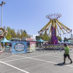 Workers set up rides at the Evergreen State Fair on Wednesday, Aug. 20, 2025 in Monroe, Washington. (Olivia Vanni / The Herald)