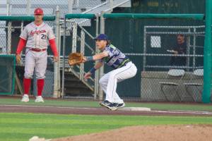 AquaSox infielder Carter Dorighi readies his glove to receive a put out at first base during Everett's 7-1 win against the Spokane Indians at Funko Field on July 25, 2025. (Joe Pohoryles / The Herald)