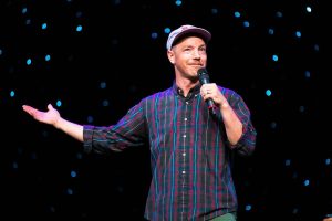 Everett comedian Taylor Clark performs stand-up in 2023 at The Triple Door in Seattle, Washington. (Photo by Mike Bryk)