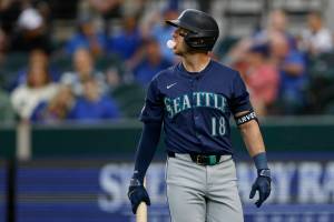 Seattle Mariners designated hitter Mitch Garver (18) walks to the dugout after striking out during the second inning against the Texas Rangers, Tuesday, April 23, 2024, in Arlington. (Elías Valverde II / The Dallas Morning News / Tribune News Services)