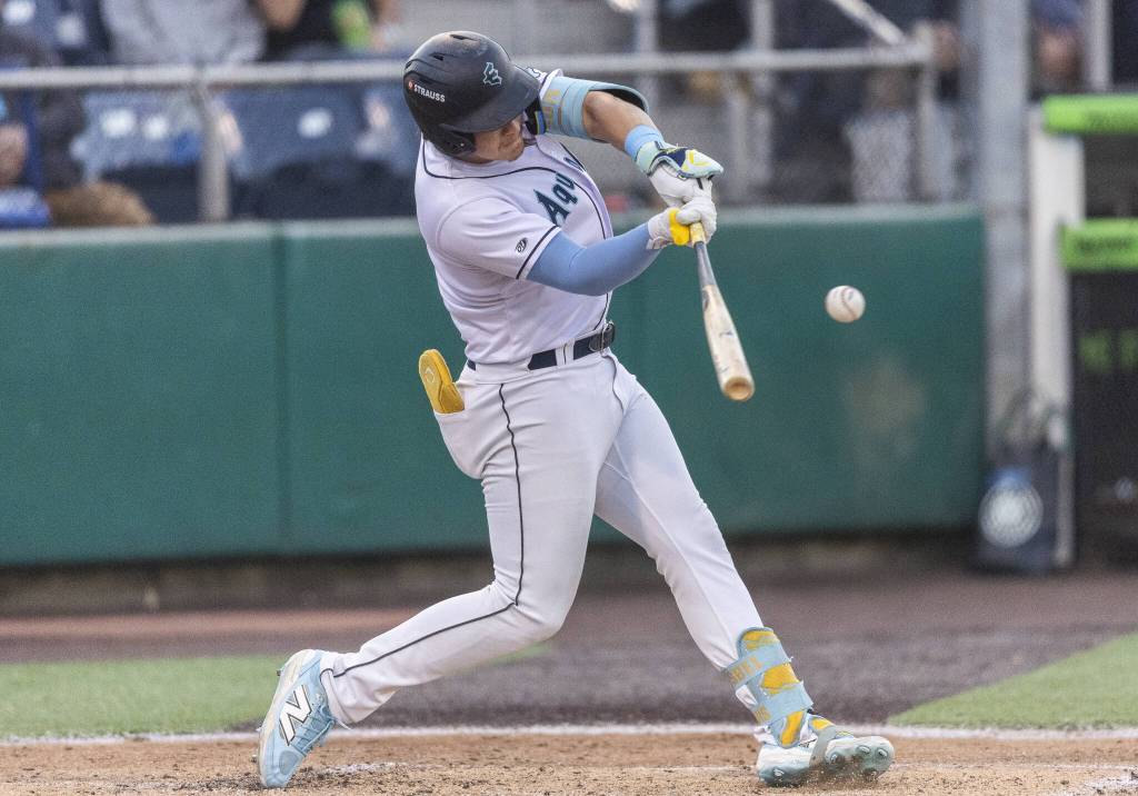 Everett AquaSox infielder Luis Suisbel gets a hit during the game against the Spokane Indians on Tuesday, Aug. 19, 2025 in Everett, Washington. (Olivia Vanni / The Herald)