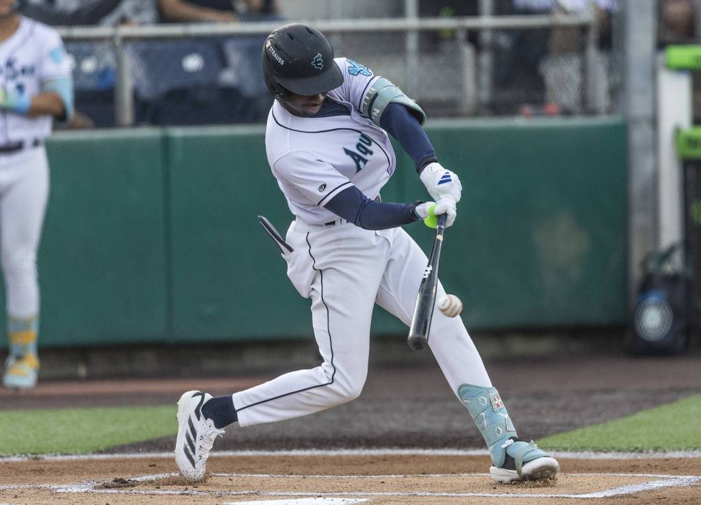 Everett AquaSox infielder Felnin Celesten makes contact with the ball during an at bat during the game against the Spokane Indians on Tuesday, Aug. 19, 2025 in Everett, Washington. (Olivia Vanni / The Herald)