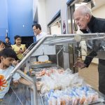 Rep. Rick Larsen, D-Everett, helps with a free lunch program at Lynnwood Elementary School on Thursday, Aug. 21, 2025 in Lynnwood, Washington. (Olivia Vanni / The Herald)