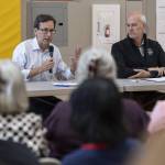 Gov. Bob Ferguson and Rep. Rick Larsen, D-Everett, talk during a listening session with with community leaders and families addressing the recent spending bill U.S. Congress enacted that cut Supplemental Nutrition Assistance Program funding by 20% on Thursday, Aug. 21, 2025 in Lynnwood, Washington. (Olivia Vanni / The Herald)