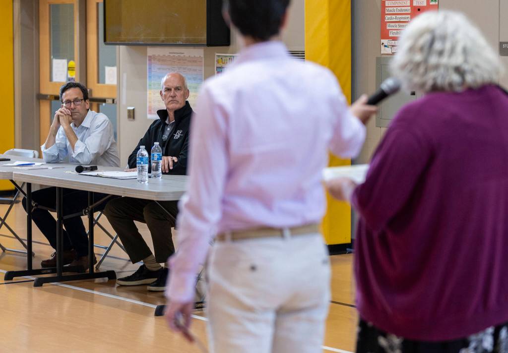 Community leaders address Gov. Bob Ferguson and Rep. Rick Larsen talk during a listening session at Lynnwood Elementary School on Thursday, Aug. 21, 2025 in Lynnwood, Washington. (Olivia Vanni / The Herald)