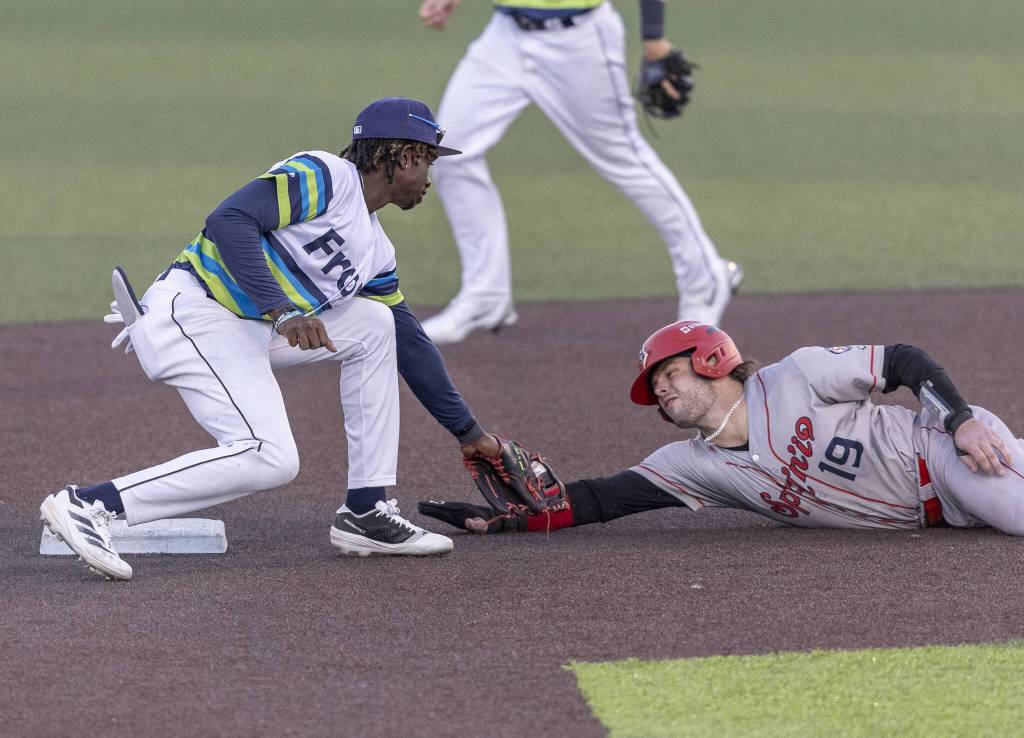 Everett AquaSox infielder Felnin Celesten tags Spokanes Cole Messina as he slides into second base during the game on Wednesday, Aug. 20, 2025 in Everett, Washington. (Olivia Vanni / The Herald)