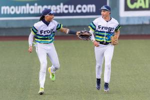 Everett AquaSox outfielder Tai Peete and Everett AquaSox outfielder Jonny Farmelo talks as they run in from the outfield between innings during the game against the Spokane Indians on Wednesday, Aug. 20, 2025 in Everett, Washington. (Olivia Vanni / The Herald)