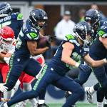 Seahawks running back Zach Charbonnet (26) runs with the ball against the Kansas City Chiefs as Seattle receiver Cooper Kupp (10) looks to block in a preseason game on Friday, Aug. 15, 2025 at Lumen Field in Seattle, Washington. (Photo courtesy of the Seattle Seahawks)