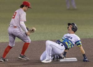 Everett AquaSox catcher Matthew Ellis smiles after almost sliding off of second base during the game against the Spokane Indians on Wednesday, Aug. 20, 2025 in Everett, Washington. (Olivia Vanni / The Herald)